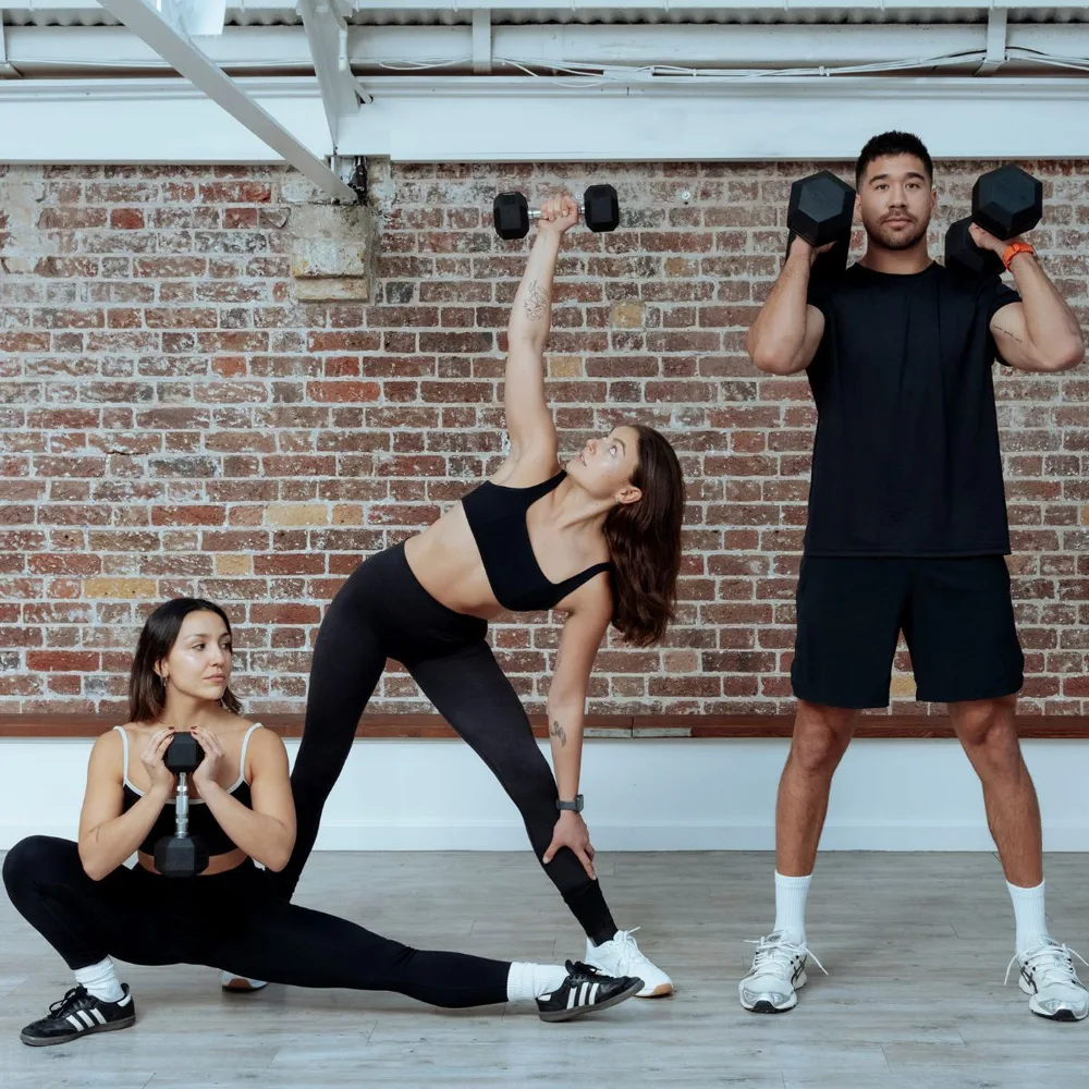 CORE clients training with dumbbells in the Weight Train studio